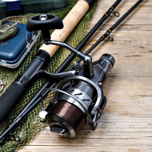 Fishing tackle on wooden background