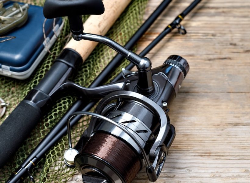 Fishing tackle on wooden background